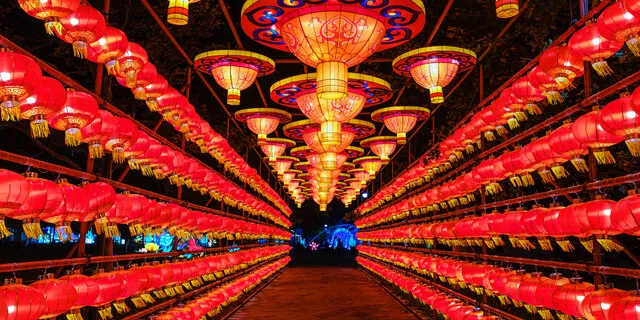 Rows of colorful red lanterns forming an illuminated tunnel at the Philadelphia Chinese Lantern Festival